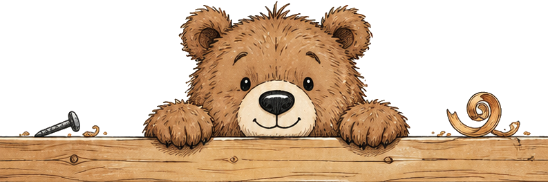 The Quirky Workshop bear peeking over a wooden workshop divider