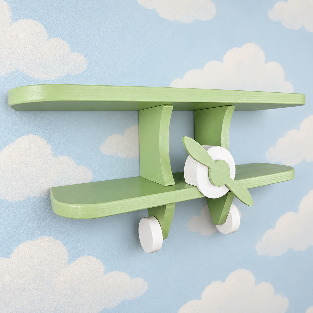 Green wooden aeroplane wall shelf for kids shown at an angle